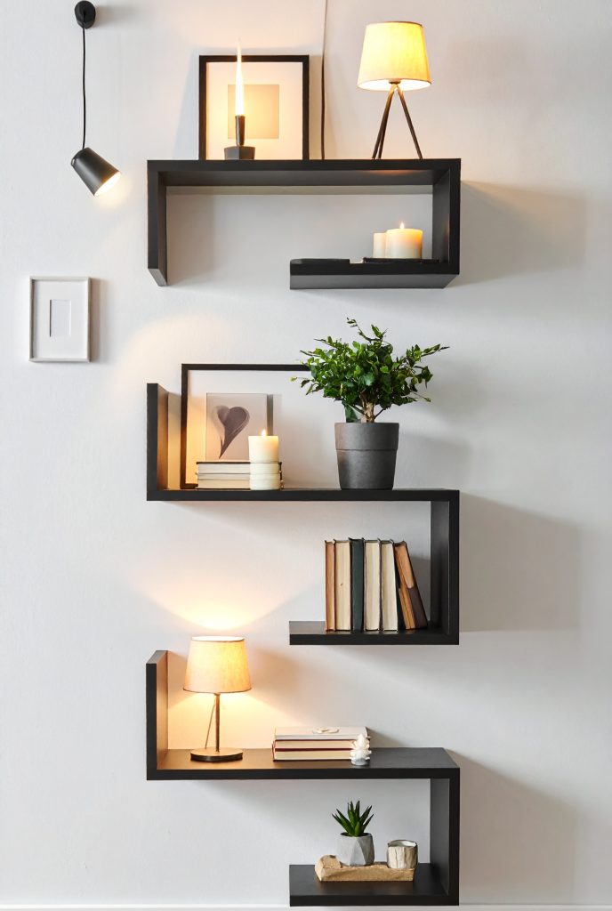 firefly a cozy and modern interior corner decorated with floating black wall shelves. the sh 255211