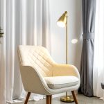 firefly a modern cozy reading corner with a stylish armchair. the chair features a quilted c 205640